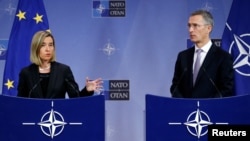 European Union foreign policy chief Federica Mogherini and NATO Secretary-General Jens Stoltenberg address a joint news conference during a NATO foreign ministers meeting at the Alliance headquarters in Brussels, Belgium, Dec. 6, 2016. 