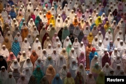 Muslim women attend prayers at the first day of the holy fasting month of Ramadan at Al-Akbar Mosque, Surabaya, East Java, Indonesia, May 16, 2018.