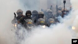 Bolivarian National Guards block students attempting to march to the Education Ministry amid tear gas in Caracas, Venezuela, May 8, 2017. 