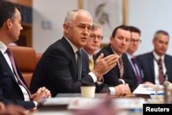 FILE - Australian Prime Minister Malcolm Turnbull speaks to state and territory leaders during a meeting of the Council of Australian Governments at Parliament House in Canberra, Australia, Oct. 5, 2017.