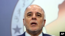 FILE - Iraq Prime Minister-designate Haider al-Abadi on Tuesday called on political leaders to end crippling feuds that have let Islamic State militants seize a third of the country.