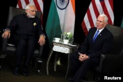 India's Prime Minister Narendra Modi and U.S. Vice President Mike Pence hold a bilateral meeting in Singapore, Nov. 14, 2018.