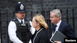 FILE - Amber Rudd arrives in Downing Street for an emergency Cabinet meeting in London, May 23, 2017.