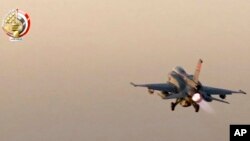 In this still image taken from video provided by the Egyptian military, an Egyptian fighter jet takes off from an undisclosed location in Egypt to strike militant hideouts in the Libyan city of Darna, May 26, 2017.