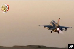 In this still image taken from video provided by the Egyptian military, an Egyptian fighter jet takes off from an undisclosed location in Egypt to strike militant hideouts in the Libyan city of Darna, May 26, 2017.
