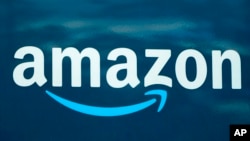 FILE - An Amazon logo appears on an Amazon delivery van, Oct. 1, 2020, in Boston.