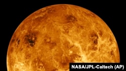 FILE - This image made available by NASA shows the planet Venus made with data produced by the Magellan spacecraft and Pioneer Venus Orbiter from 1990 to 1994.