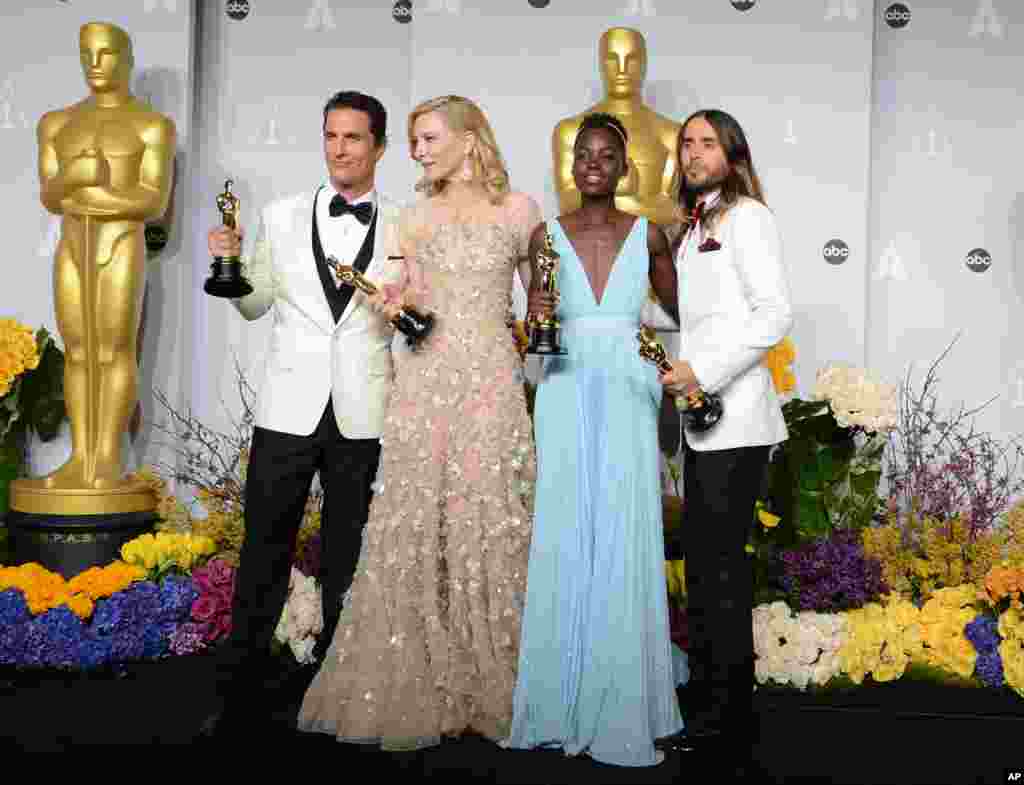 From Left, Matthew McConaughey, Cate Blanchett, Lupita Nyong'o, and Jared Leto pose in the press room with their awards during the Oscars at the Dolby Theatre, March 2, 2014, in Los Angeles.