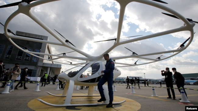 A pilot gets off a "Volocopter 2X" drone taxi during an Urban Air Mobility Airport Demo event at Gimpo Airport in Seoul, South Korea, November 11, 2021. (REUTERS/Heo Ran)