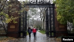 FILE - Students walk on the campus of Yale University in New Haven, Connecticut, Nov. 12, 2015. 