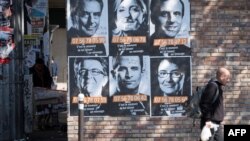 Posters of French presidential election candidates as part of a campaign of "Solidarite Sida" in Paris, France, April 19, 2017.