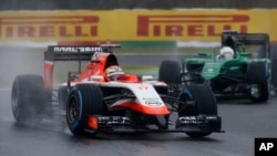 Marussia driver Jules Bianchi of France leads Caterham driver Kamui Kobayashi of Japan during the Japanese Formula One Grand Prix at the Suzuka Circuit in Suzuka, central Japan, Sunday, Oct. 5, 2014.