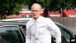 FILE - U.S. Dentist Walter Palmer, who for weeks stayed out of the public eye after being identified as the hunter who killed Cecil the lion, is seen outside his practice in Bloomington, Minnesota, Sept. 8, 2015.