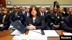 U.S. Secret Service Director Julia Pierson prepares to testify to the House Oversight and Government Reform Committee hearing, Sept. 30, 2014. Pierson resigned a day later. (REUTERS/Kevin Lamarque)