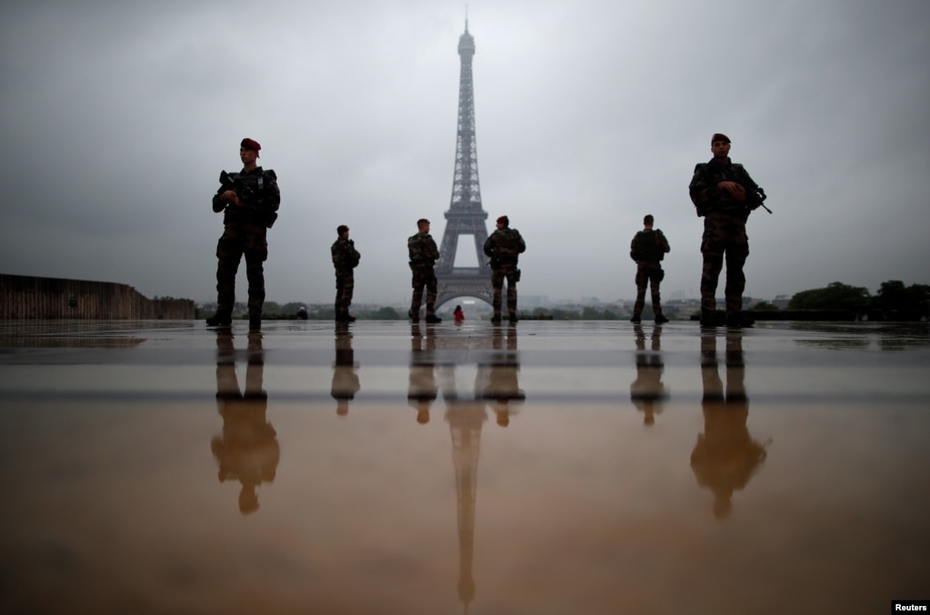 French soldiers patrol near the Eiffel Tower as part of the &quot;Sentinelle&quot; security plan in Paris.