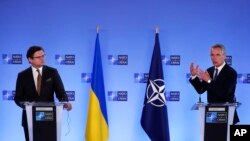 NATO Secretary General Jens Stoltenberg, right, and Ukraine's Foreign Minister Dmytro Kuleba participate in a media conference at NATO headquarters in Brussels, Belgium, April 13, 2021.