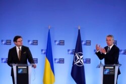 NATO Secretary General Jens Stoltenberg, right, and Ukraine's Foreign Minister Dmytro Kuleba participate in a media conference at NATO headquarters in Brussels, Belgium, April 13, 2021.