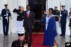 FILE - Teodoro Obiang Nguema Mbasogo, President of the Republic of Equatorial Guinea, and wife Constancia Mangue De Obiang, arrive for a dinner hosted by President Barack Obama for the U.S. Africa Leaders Summit, Aug. 5, 2014.