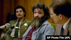 In this 1986 file photo, convicted killer Charles Manson is seen during a parole hearing in California. 