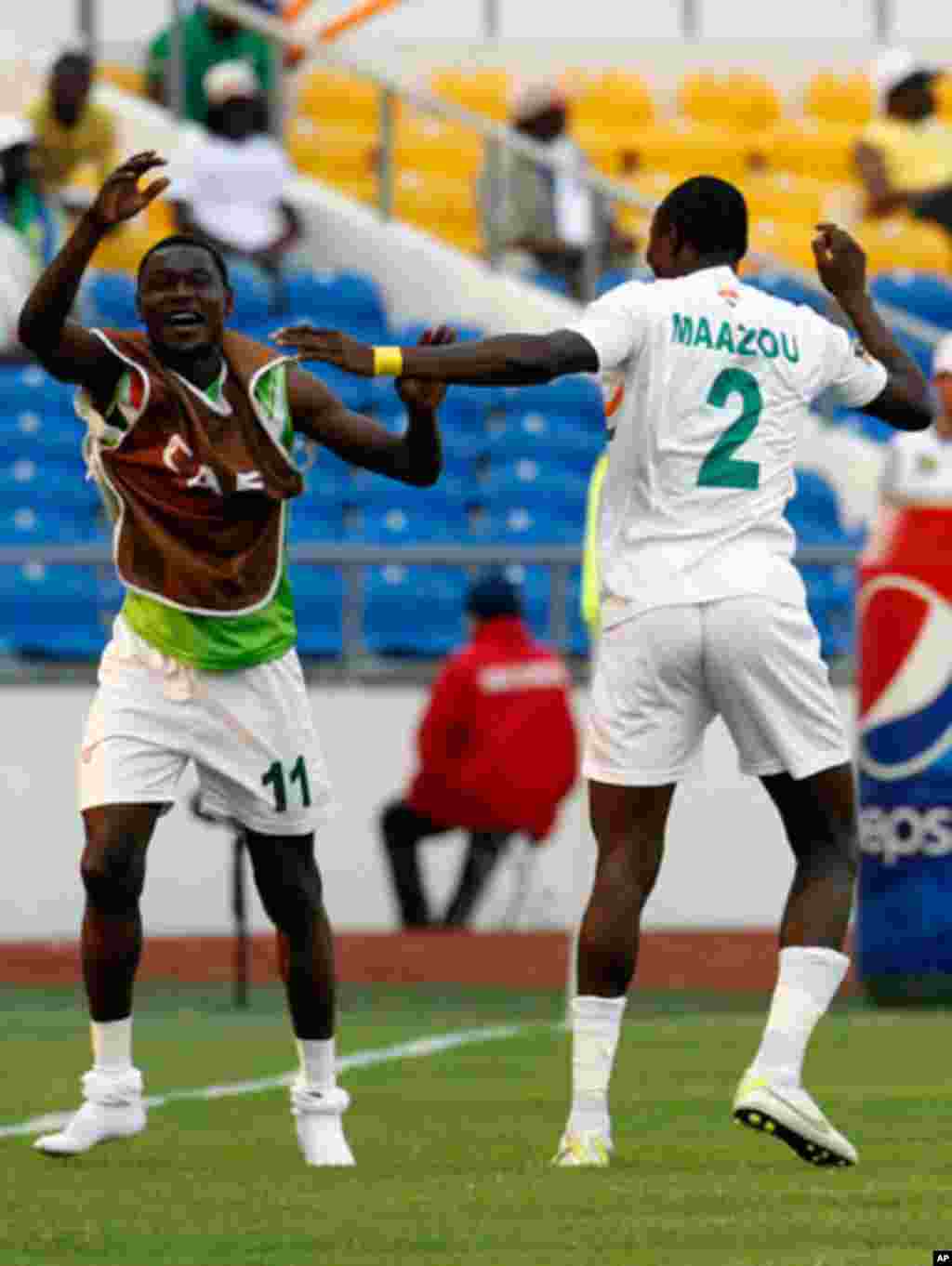 Niger's Moussa celebrates his goal against Tunisia with Allagui during their African Cup of Nations soccer match in Libreville
