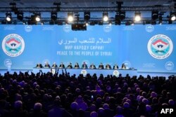 FILE - Delegates attend a plenary session at the Congress of Syrian National Dialogue in Sochi, Jan. 30, 2018.