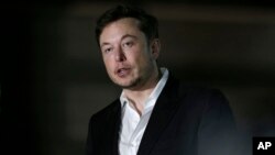 FILE-Tesla CEO and founder of the Boring Company Elon Musk speaks at a news conference in Chicago, June 14, 2018.