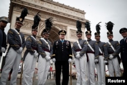 West Point cadets pose before a commemoration ceremony for Armistice Day, 100 years after the end of the First World War at the Arc de Triomphe in Paris, France, Nov. 11, 2018.