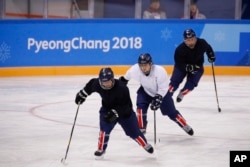 The joint Korean women's ice hockey players train prior to the 2018 Winter Olympics in Gangneung, South Korea, Monday, Feb. 5, 2018. (AP Photo/Jae C. Hong)