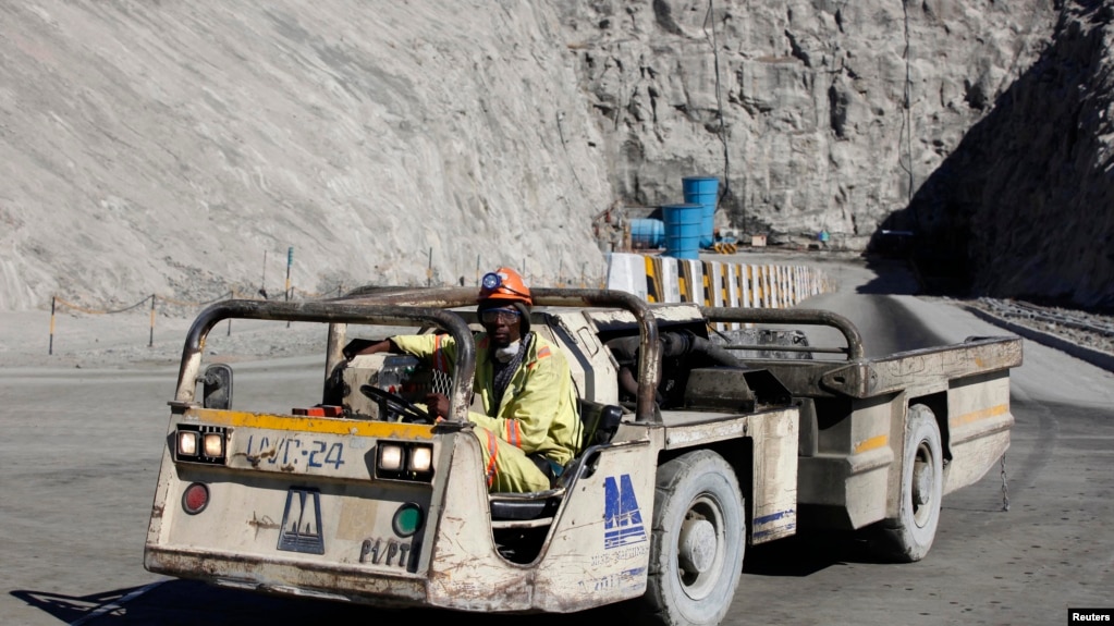 FILE - A worker drives a vehicle at Zimplats' Ngwarati Mine in Mhondoro-Ngezi May 30, 2014.