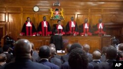 Kenyan Supreme Court judges, from left, Njoki Ndung'u, Jackton Ojwang, Deputy Chief Justice Philomela Mwilu, Chief Justice David Maraga, Smokin Wanjala and Isaac Lenaola preside over the hearing of the petitions, Nov. 14, 2017. The court that made history when it nullified Kenyatta's election in August, is hearing petitions challenging President Uhuru Kenyatta's re-election. 