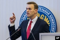 Russian opposition leader Alexei Navalny, who submitted endorsement papers necessary for his registration as a presidential candidate, speaks at the Russia's Central Election commission in Moscow, Dec. 25, 2017.