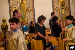 Members of the Arab-American community worship at St. Mary's Antiochian Orthodox Church in the Brooklyn borough of New York, Oct. 9, 2016.