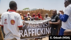 Activists from the "Up Against Trafficking" campaign gather in the neighborhood of Madinatu in Maiduguri, Borno State, to talk to people about the dangers of human trafficking. 