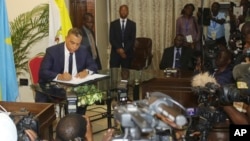 Olivier Kamitatu, who participated in a political agreement in Congo calling for President Joseph Kabila to leave power, is shown during a signing ceremony in Kinshasa, Democratic Republic of Congo, Dec. 31, 2016.