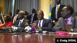 FILE - South Sudan’s First Vice President Taban Deng Gai, center, speaks to reporters in Nairobi, Kenya, Aug. 17, 2016.