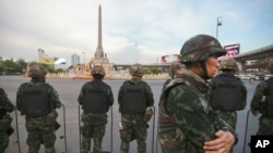 FILE - Thai soldiers guard an area to prevent an anti-coup demonstration at Victory Monument in Bangkok, Thailand.