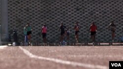 Sprinters during practice for the Olympics in Swaziland, July 2012 (Emilie Iob/VOA)