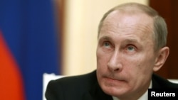 Russia's President Vladimir Putin looks on during a news conference at the Kremlin in Moscow, November 8, 2012. 