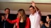 Spanish Prime Minister and Socialist Party candidate Pedro Sanchez stands with his wife Maria Begona Gomez as he waves to supporters gathered at the party headquarters waiting for results of the general election in Madrid, Sunday, April 28, 2019. 