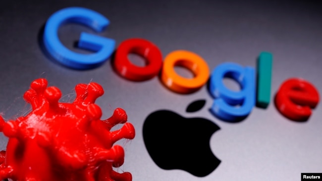 3D printed coronavirus model and Google logo are placed near an Apple Macbook Pro in this illustration taken April 12, 2020. REUTERS/Dado Ruvic/Illustration