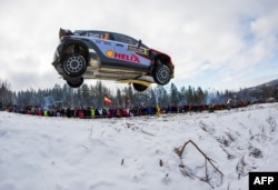 Well, you can drive fast in Sweden if you're in a race! Here, Thierry Neuville of Belgium and his co-driver Nicolas Gilsoul race in Rally Sweden. This is the 2nd round of the FIA World Rally Championship, 2016 in Hagfors, Sweden.