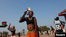 A traditional dancer takes part in celebrations marking the third anniversary of South Sudan's independence, in Juba, July 9, 2014. 