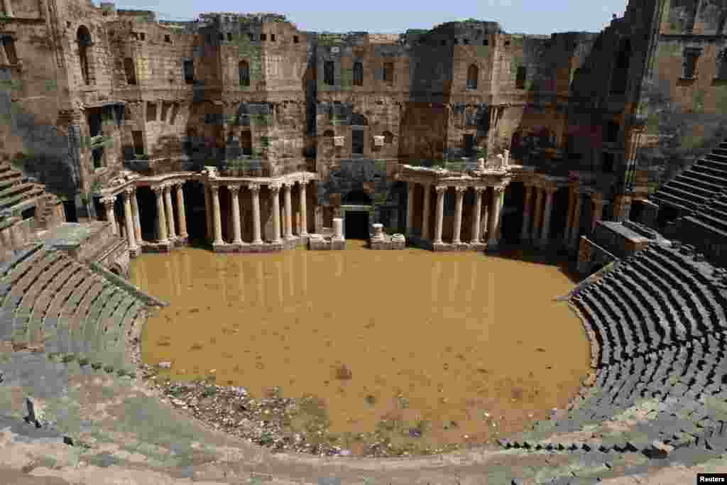 The 2nd-century Roman amphitheater is flooded following heavy rain in the southern town of Bosra al-Sham, Syria, April 29, 2018.