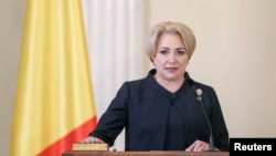 Romanian Prime Minister Viorica Dancila is sworn during a ceremony at the Cotroceni Presidential Palace in Bucharest, Romania, Jan. 29, 2018. 
