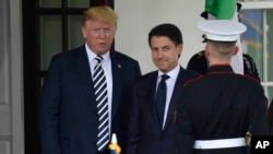 President Donald Trump welcomes Italian Prime Minister Giuseppe Conte, center, to the West Wing in Washington, July 30, 2018.