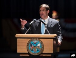 FILE - The 23rd Secretary of the Army, Mark Esper speaks at Conmy Hall at Joint Base Myer-Henderson Hall, Virginia, Jan. 5, 2018, during a full honor arrival ceremony in his honor.