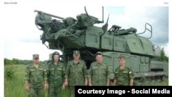 RUSSIA-Russian officers with BUK missile launcher from bellingcat investigation.