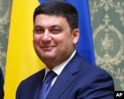 FILE - Ukraine's Prime Minister Volodymyr Groysman may struggle to get unpalatable pension reforms requested by the IMF through parliament, which include ending early retirement privileges for teachers and doctors.