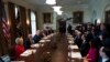 President Donald Trump, third from left, speaks during a bicameral meeting with lawmakers working on the tax cuts in the Cabinet Meeting Room of the White House in Washington, Wednesday, Dec. 13, 2017