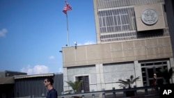 FILE - A pedestrian passes the U.S Embassy in Tel Aviv, Israel, Aug. 4, 2013. President-elect Donald Trump has said he would like to move the embassy to Jerusalem.